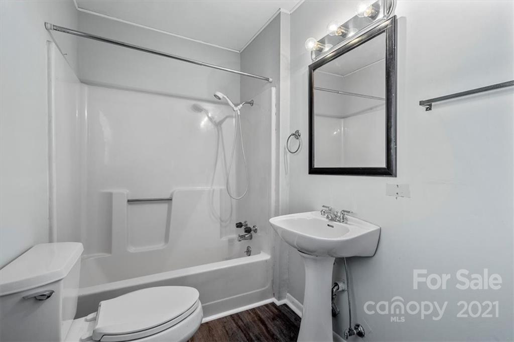 4919 Seacroft Road Charlotte, NC 28210 - Photo 14 of 25 a bathroom with a sink toilet and shower