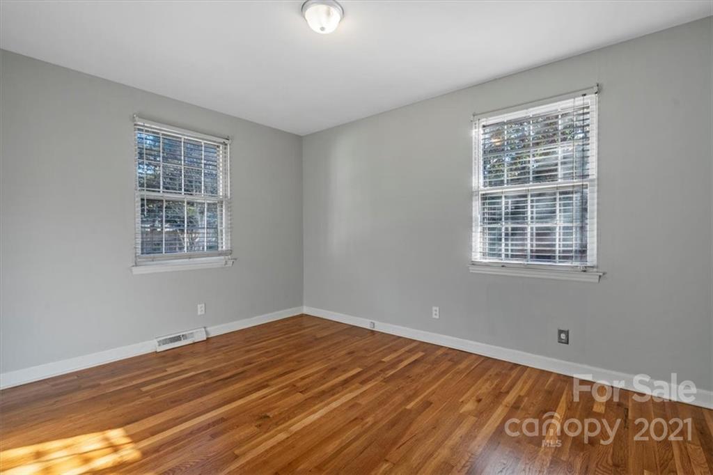 4919 Seacroft Road Charlotte, NC 28210 - Photo 16 of 25 a view of a room with wooden floor and windows