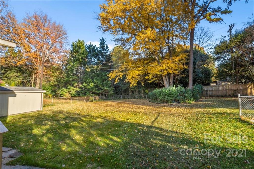 4919 Seacroft Road Charlotte, NC 28210 - Photo 20 of 25 a view of a swimming pool with an outdoor space and seating area