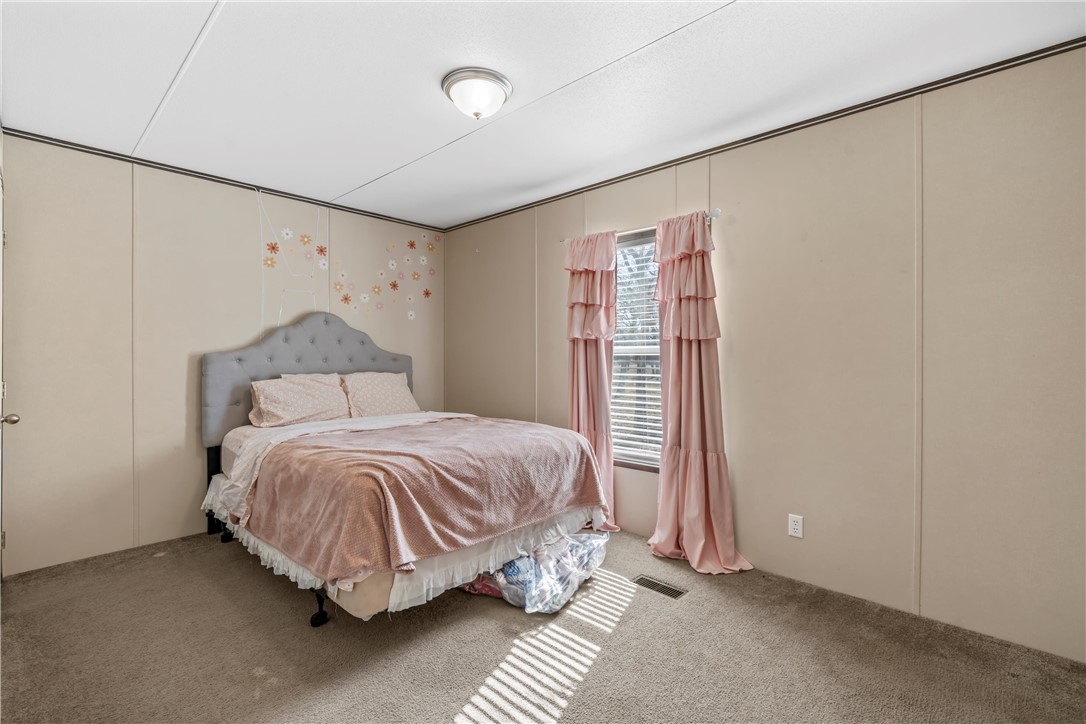 5481 Tokio Road West, TX 76691 - Photo 13 of 23 a bedroom with a bed and a window