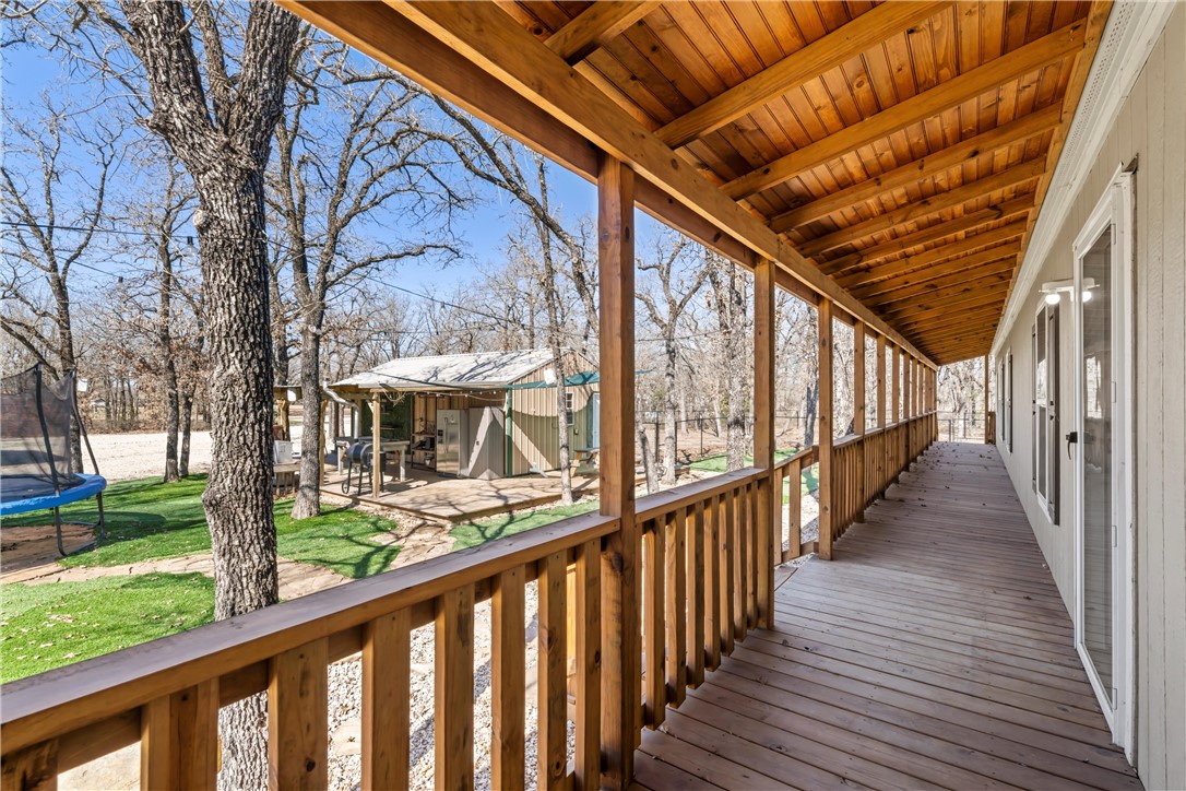 5481 Tokio Road West, TX 76691 - Photo 2 of 23 a view of a porch with wooden floor and stairs