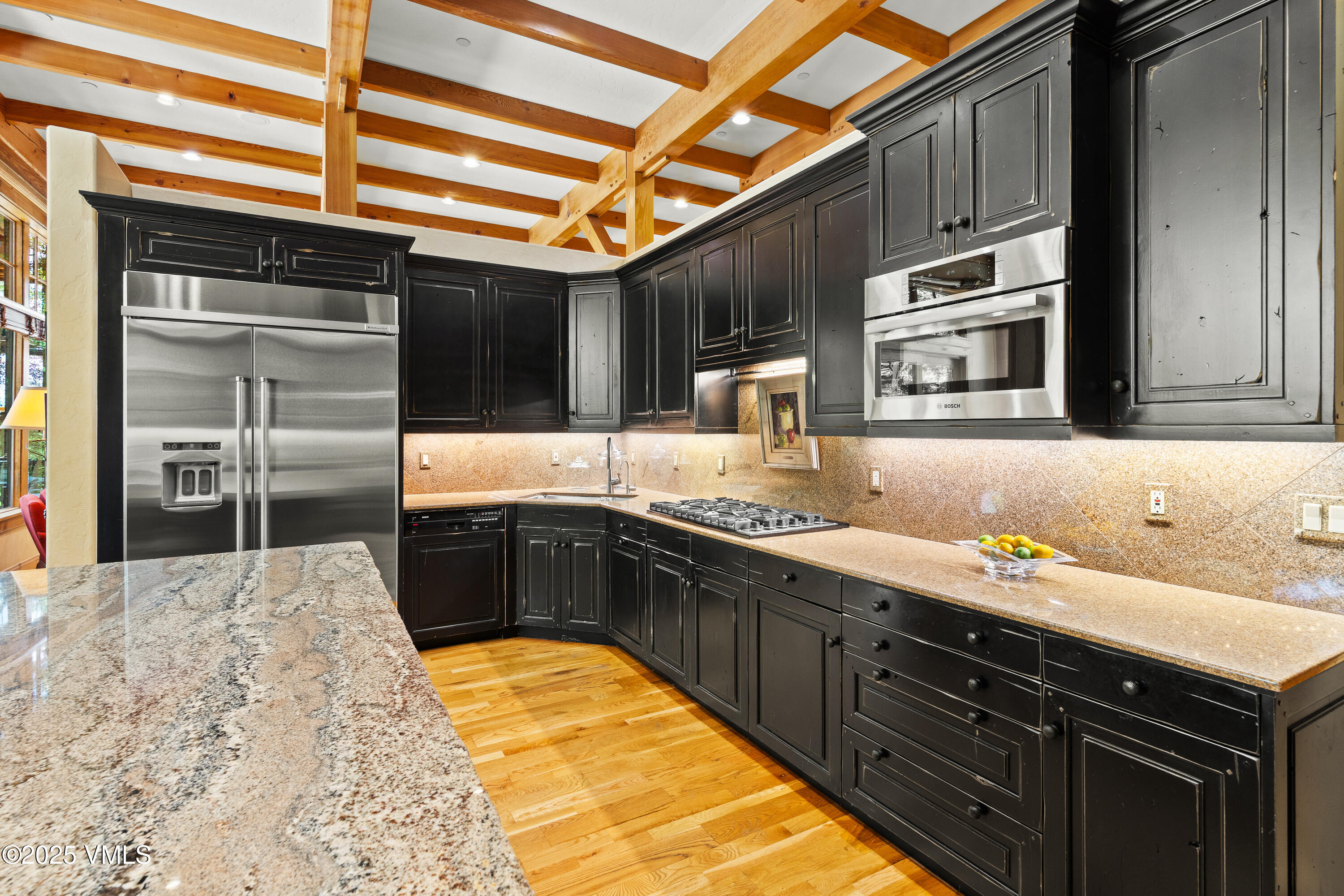 33 Grey Hawk Lane Edwards, CO 81632 - Photo 17 of 78 a kitchen with stainless steel appliances granite countertop a sink stove and cabinets