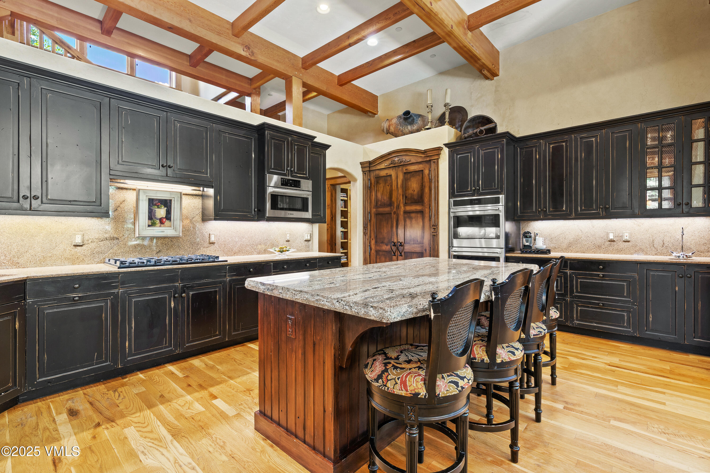 33 Grey Hawk Lane Edwards, CO 81632 - Photo 18 of 78 a kitchen with stainless steel appliances granite countertop a stove a sink dishwasher and cabinets with wooden floor