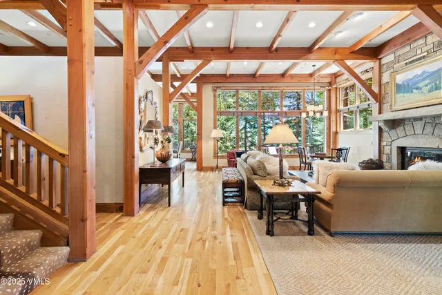 a living room with furniture and a floor to ceiling window