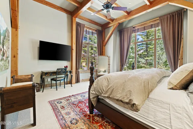a spacious bathroom with a double vanity sink large mirror and a bathtub