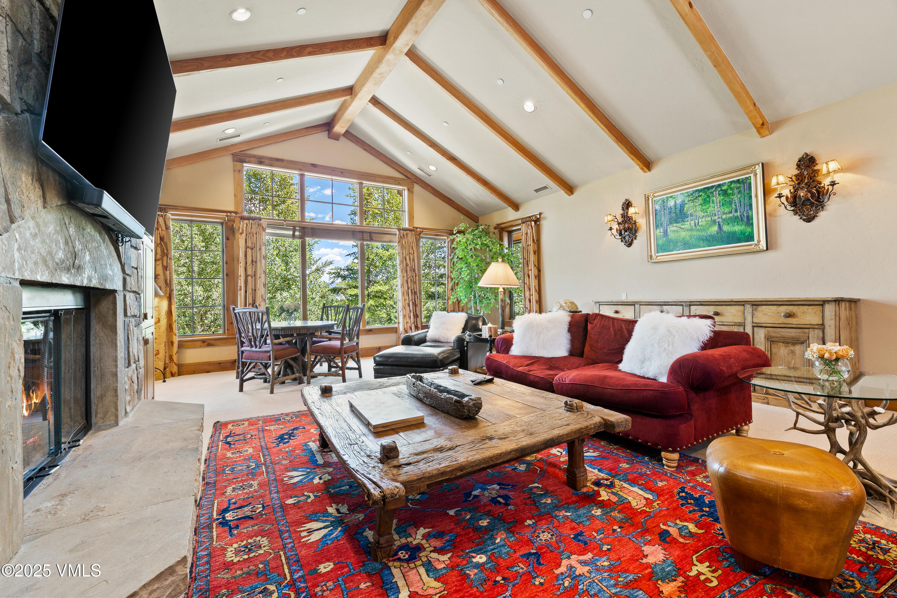 33 Grey Hawk Lane Edwards, CO 81632 - Photo 30 of 78 a living room with furniture a rug and a floor to ceiling window