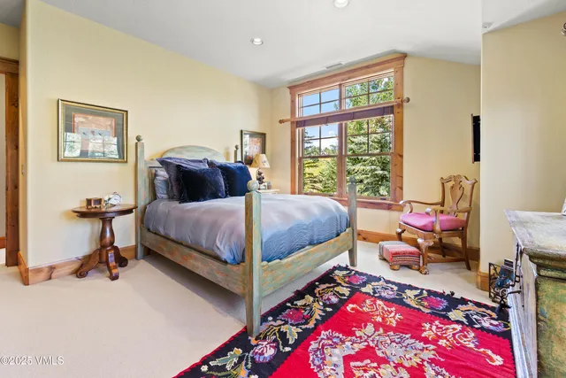 a bedroom with a bed and dresser