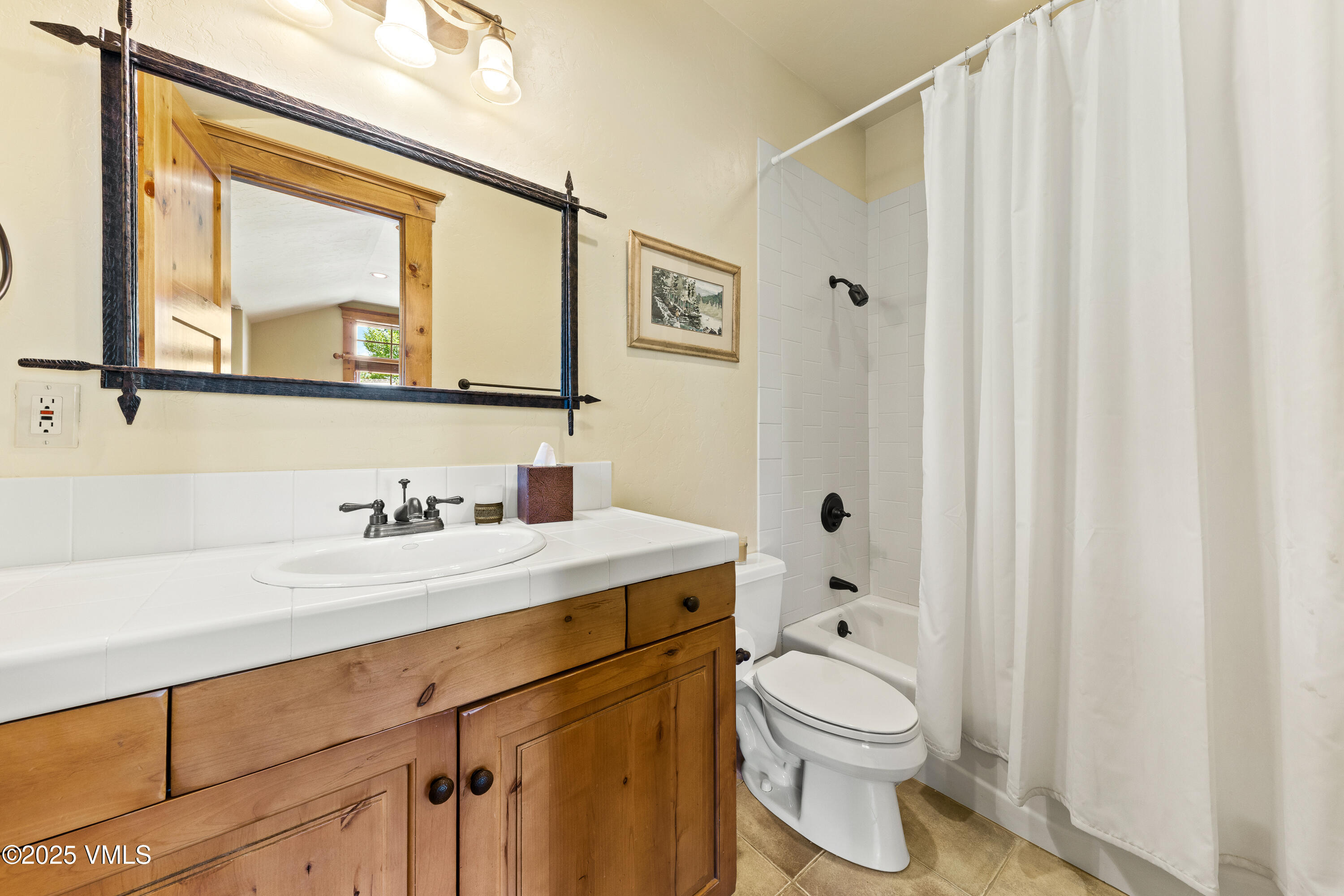 33 Grey Hawk Lane Edwards, CO 81632 - Photo 37 of 78 a bathroom with a granite countertop toilet sink and mirror