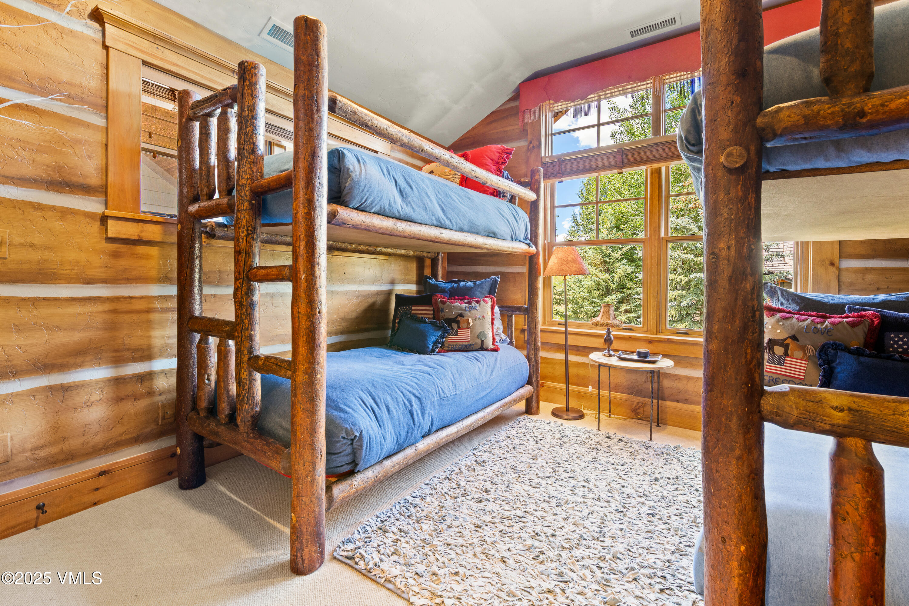 33 Grey Hawk Lane Edwards, CO 81632 - Photo 38 of 78 a bedroom with a bed and a large window with balcony view