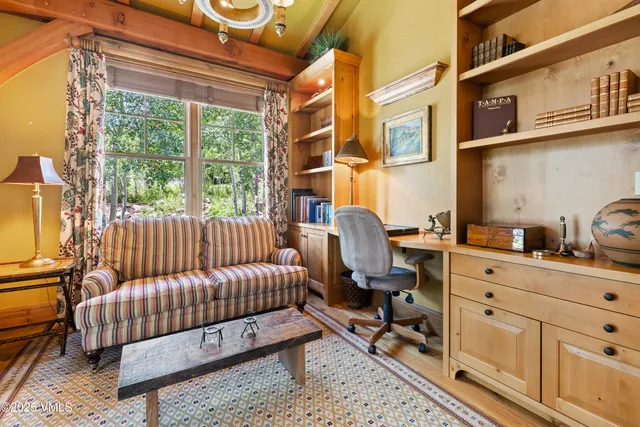 a view of a dining room with furniture wooden floor and a chandelier