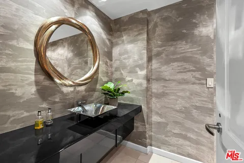 a spacious bedroom with a bed and a dresser in it