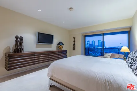 a bedroom with furniture and a table