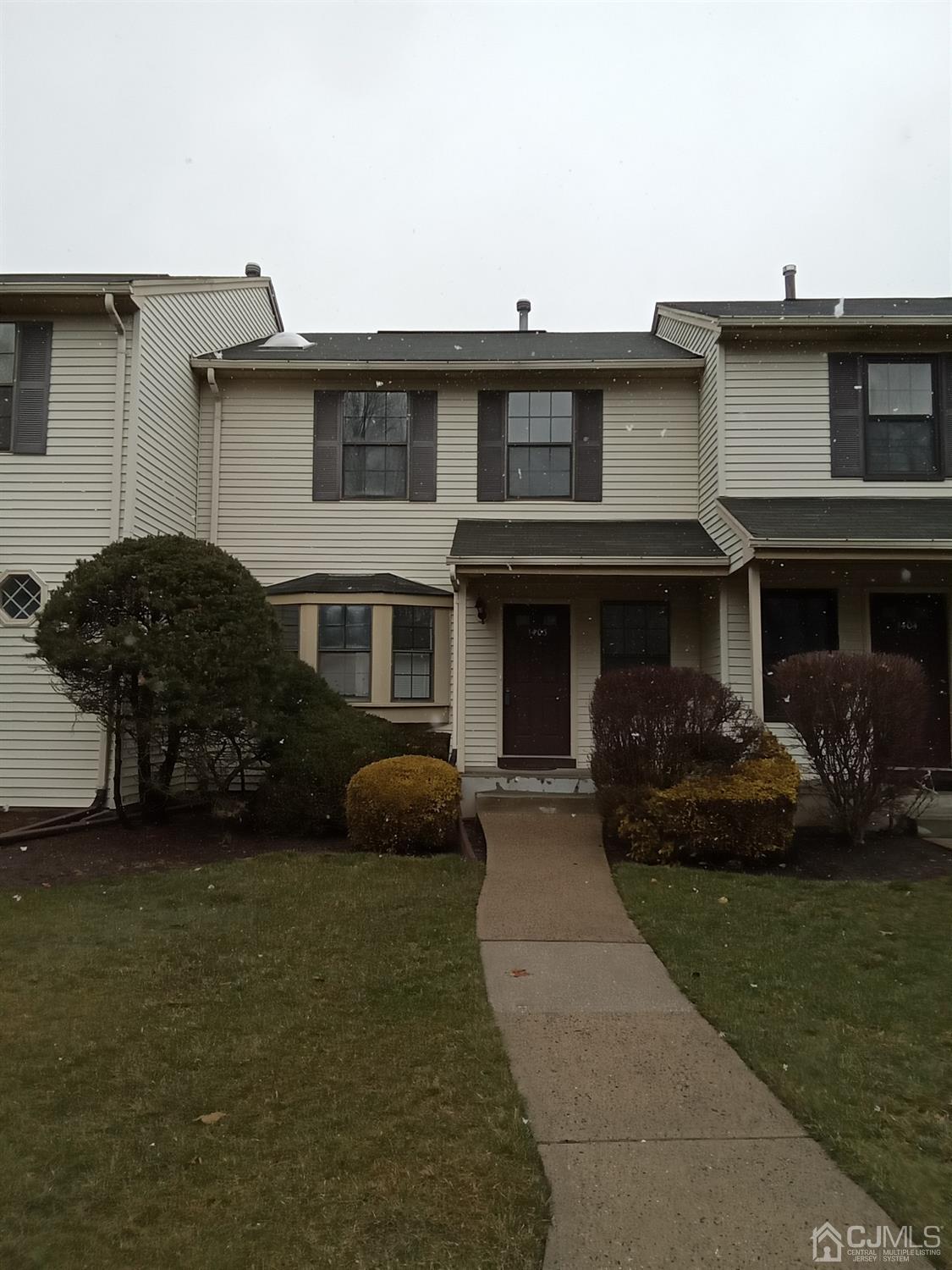 1403 Timber Oaks Road Edison, NJ 08820 - Photo 1 of 6 a front view of a house with garden