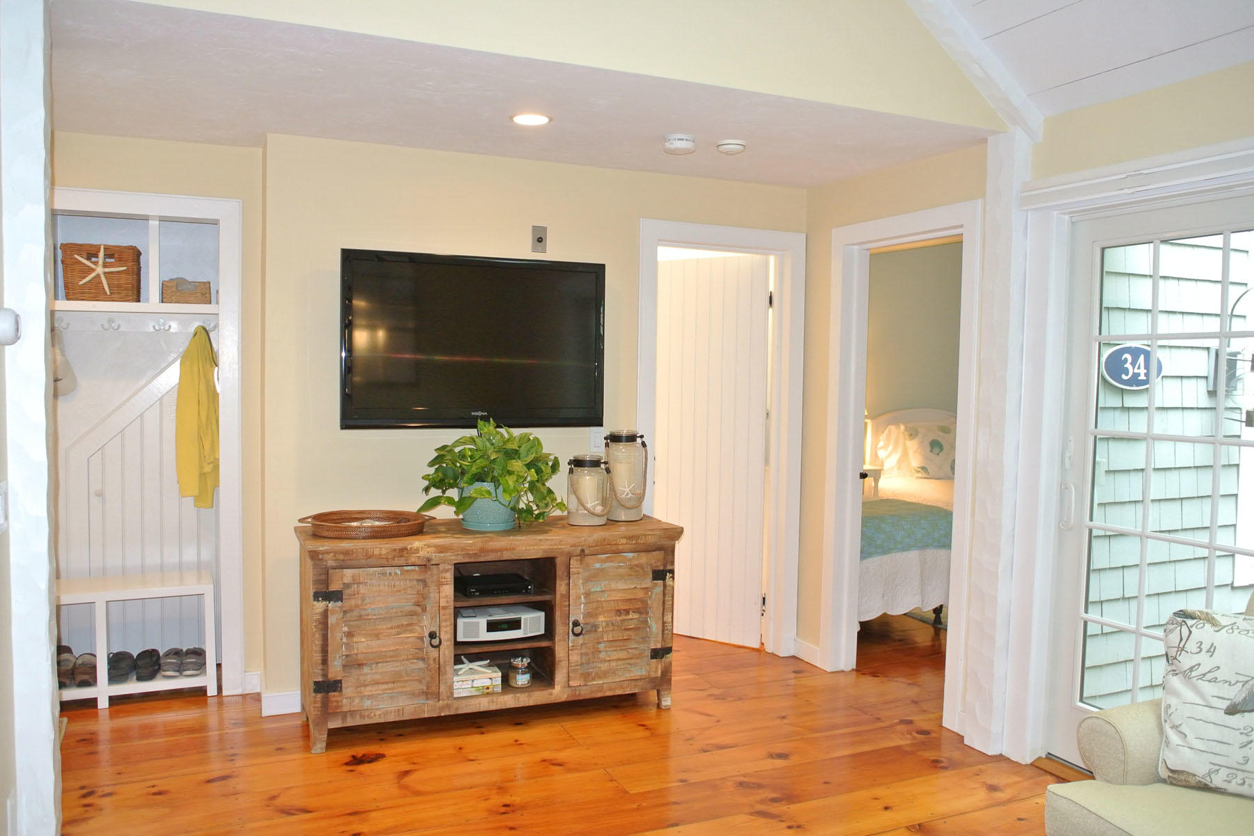 34 Brant Rock Road Mashpee, MA 02649 - Photo 4 of 15 a living room with furniture and a flat screen tv