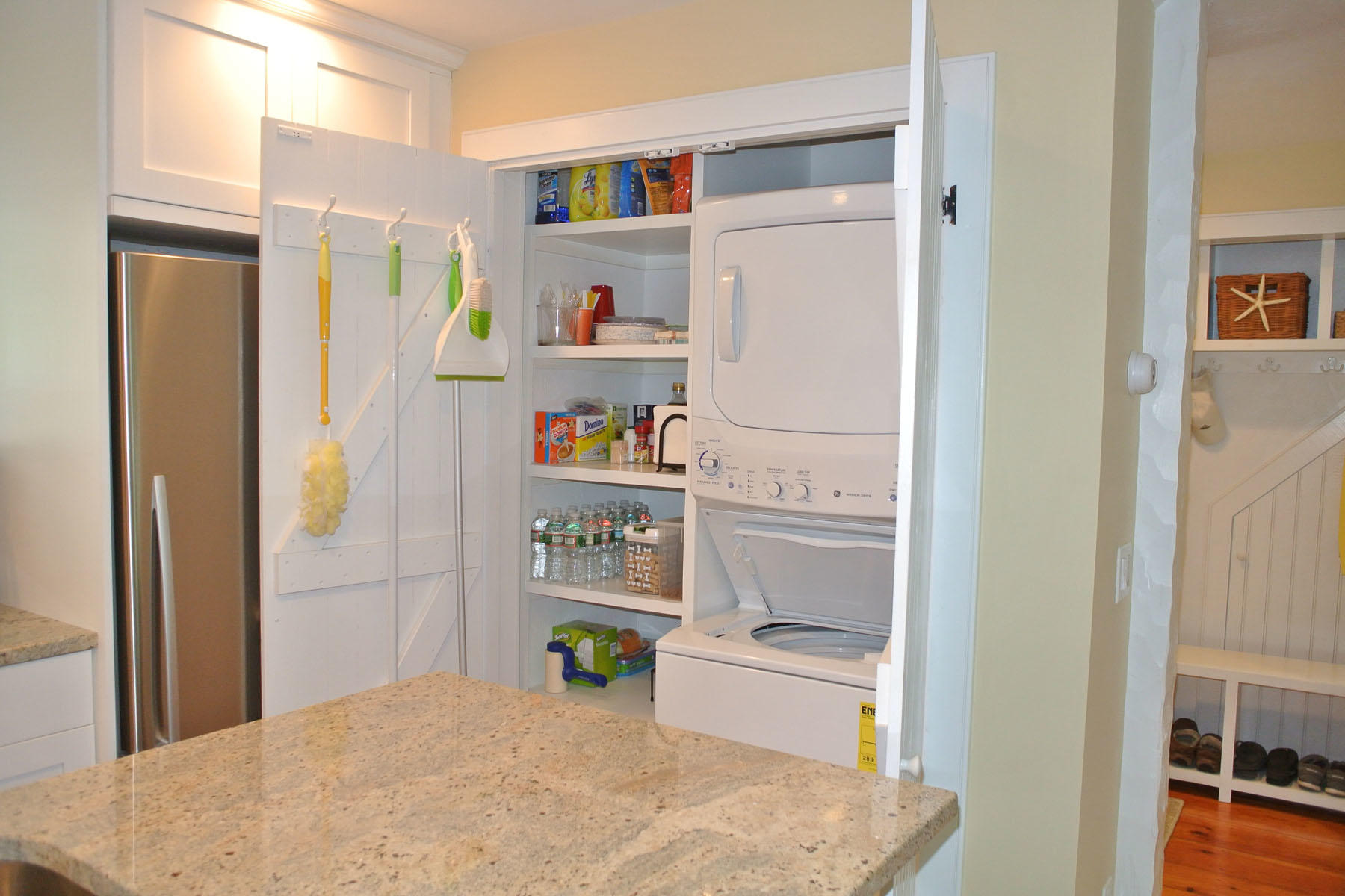 34 Brant Rock Road Mashpee, MA 02649 - Photo 6 of 15 a kitchen with a refrigerator and cabinets