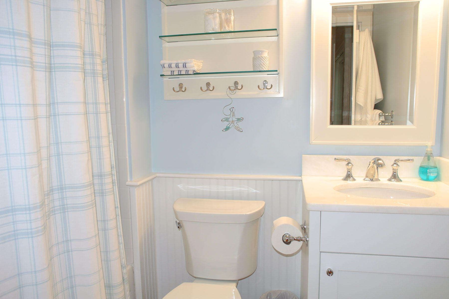 34 Brant Rock Road Mashpee, MA 02649 - Photo 8 of 15 a bathroom with a sink a toilet and vanity