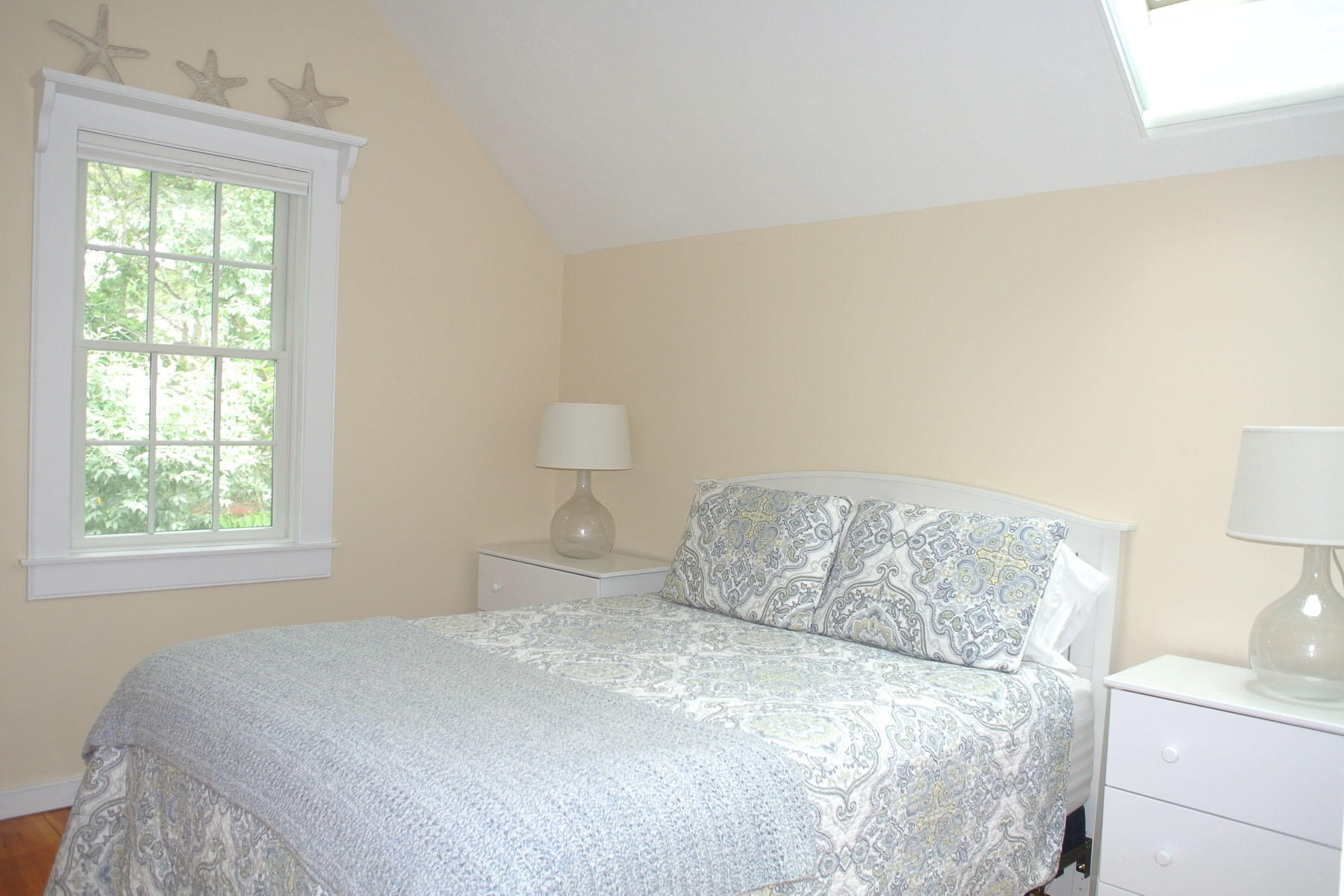 34 Brant Rock Road Mashpee, MA 02649 - Photo 10 of 15 a bedroom with a bed and a window