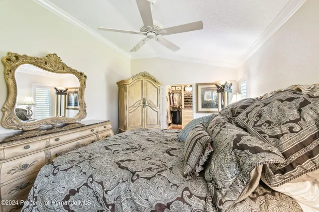 a living room with furniture a flat screen tv and a window