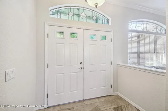 a living room with furniture or window and a wooden floor