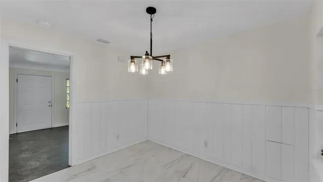 a kitchen with stainless steel appliances granite countertop a sink a stove a refrigerator a microwave and cabinets