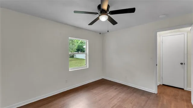 a view of an empty room with a large window