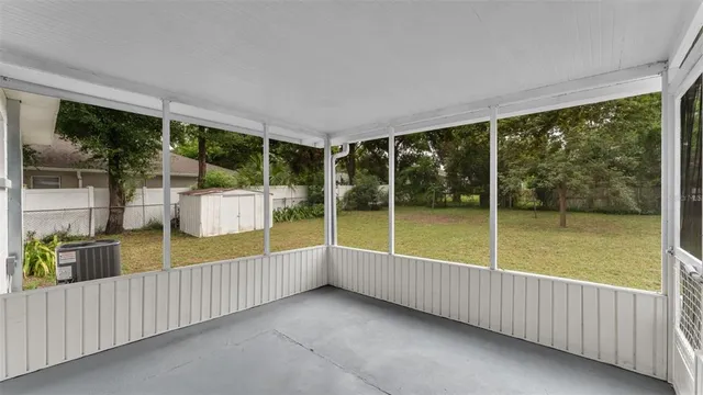 a view of a house with yard and a garden