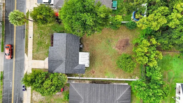an aerial view of house with yard swimming pool and outdoor seating