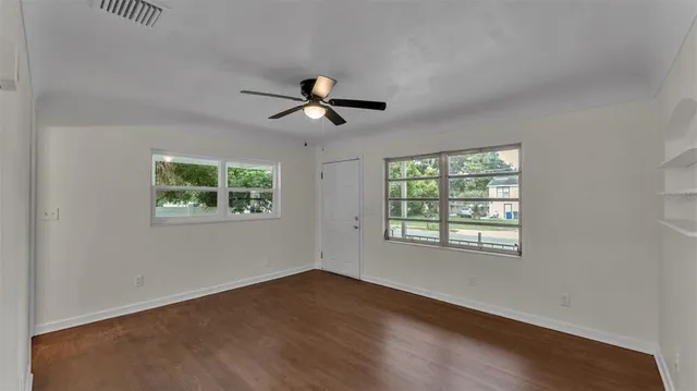 a view of an empty room with a window