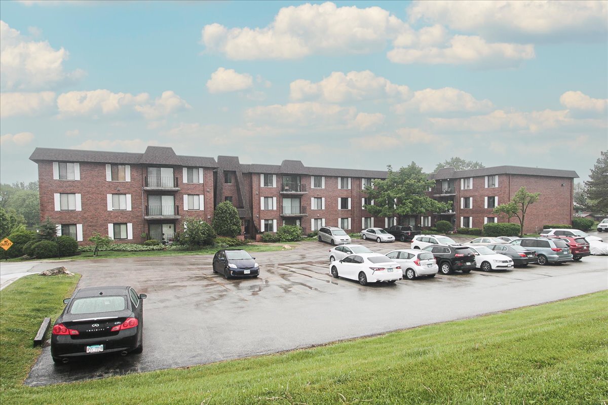 100 Clubhouse Lane, Unit 105B Lake Zurich, IL 60047 - Photo 1 of 1 a car parked in front of a house
