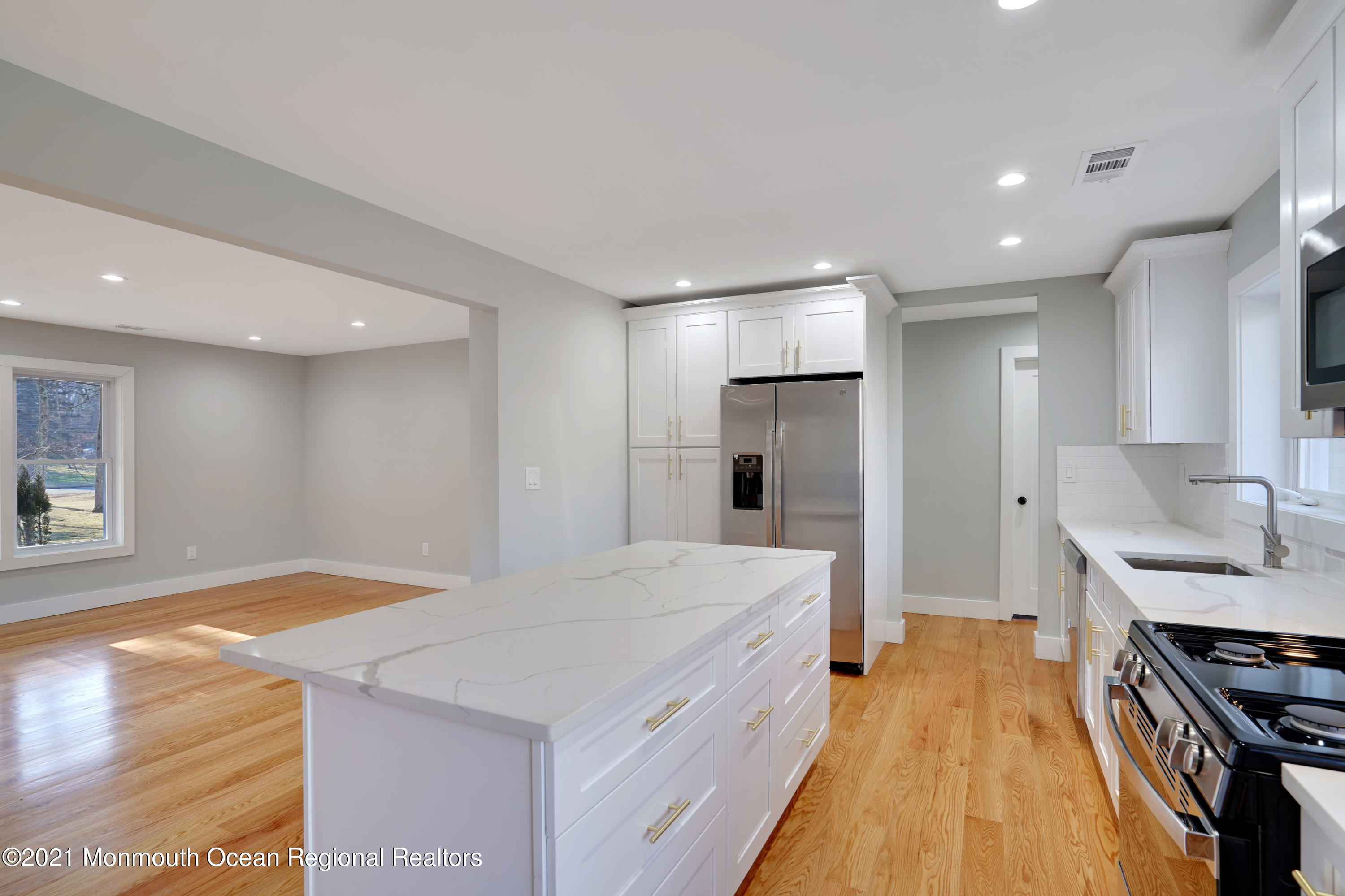 1155 Crim Road Bridgewater, NJ 08807 - Photo 11 of 29 a large white kitchen with a stove a sink a refrigerator and a stove