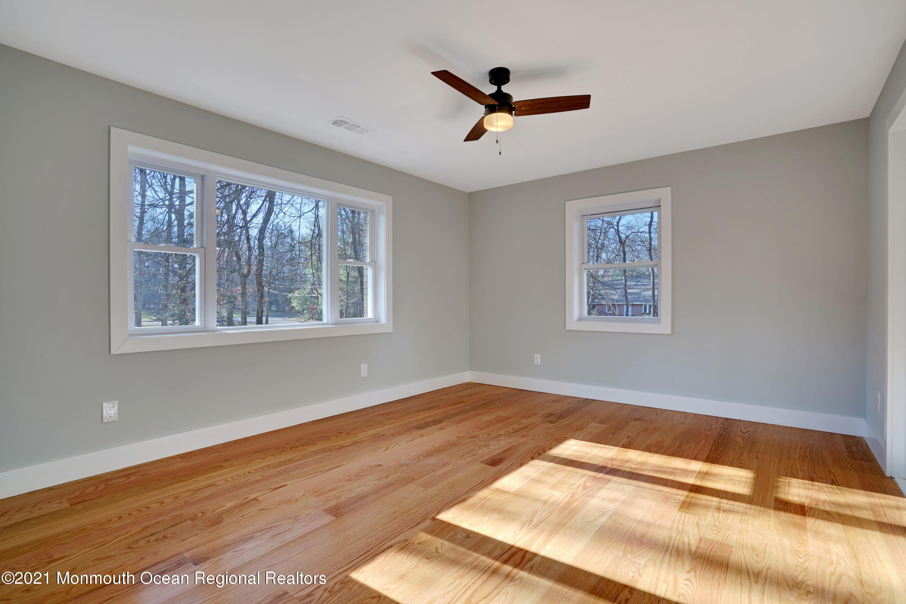 1155 Crim Road Bridgewater, NJ 08807 - Photo 17 of 29 a view of empty room with wooden floor and fan