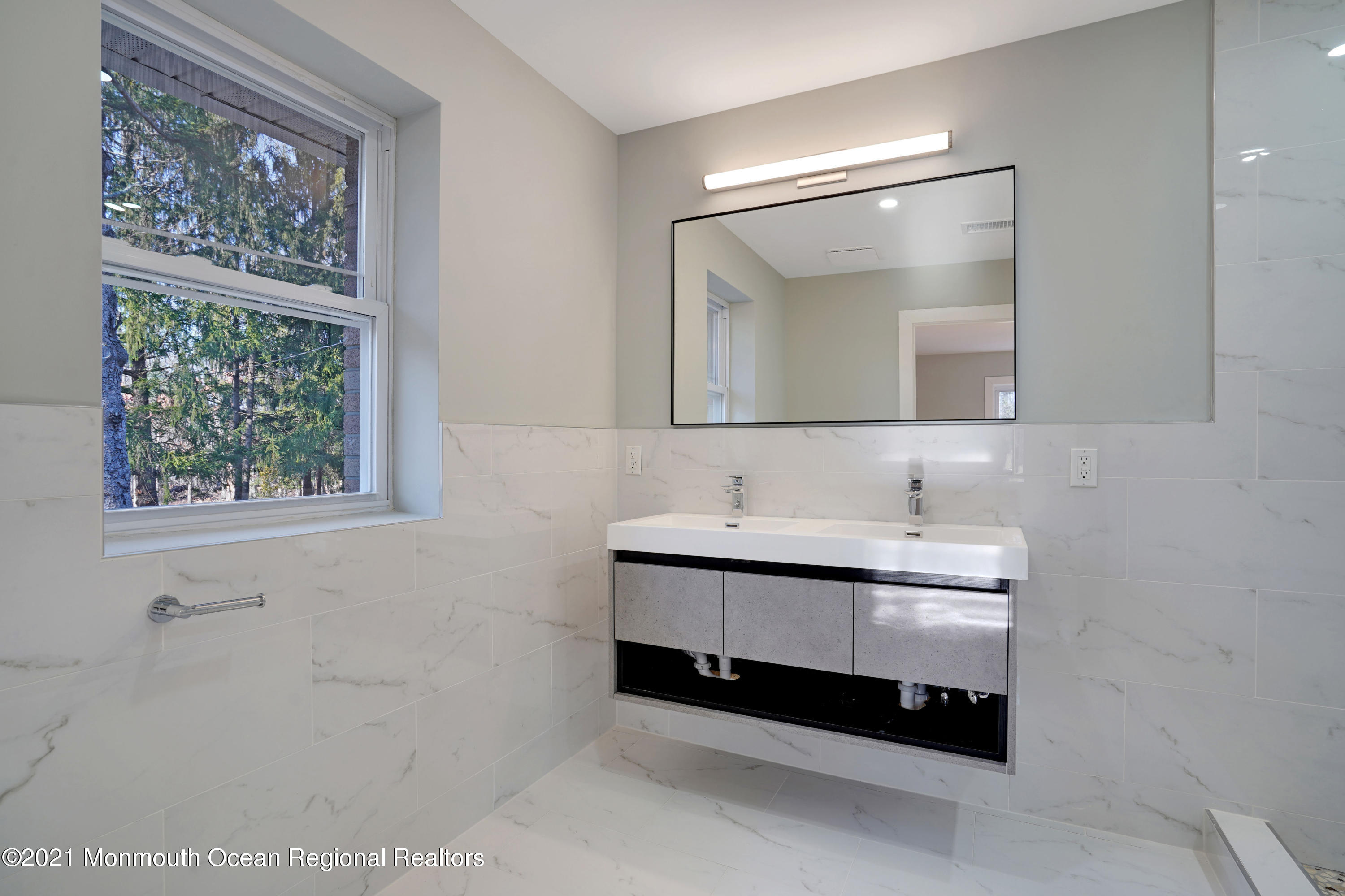 1155 Crim Road Bridgewater, NJ 08807 - Photo 18 of 29 a bathroom with a sink and a mirror