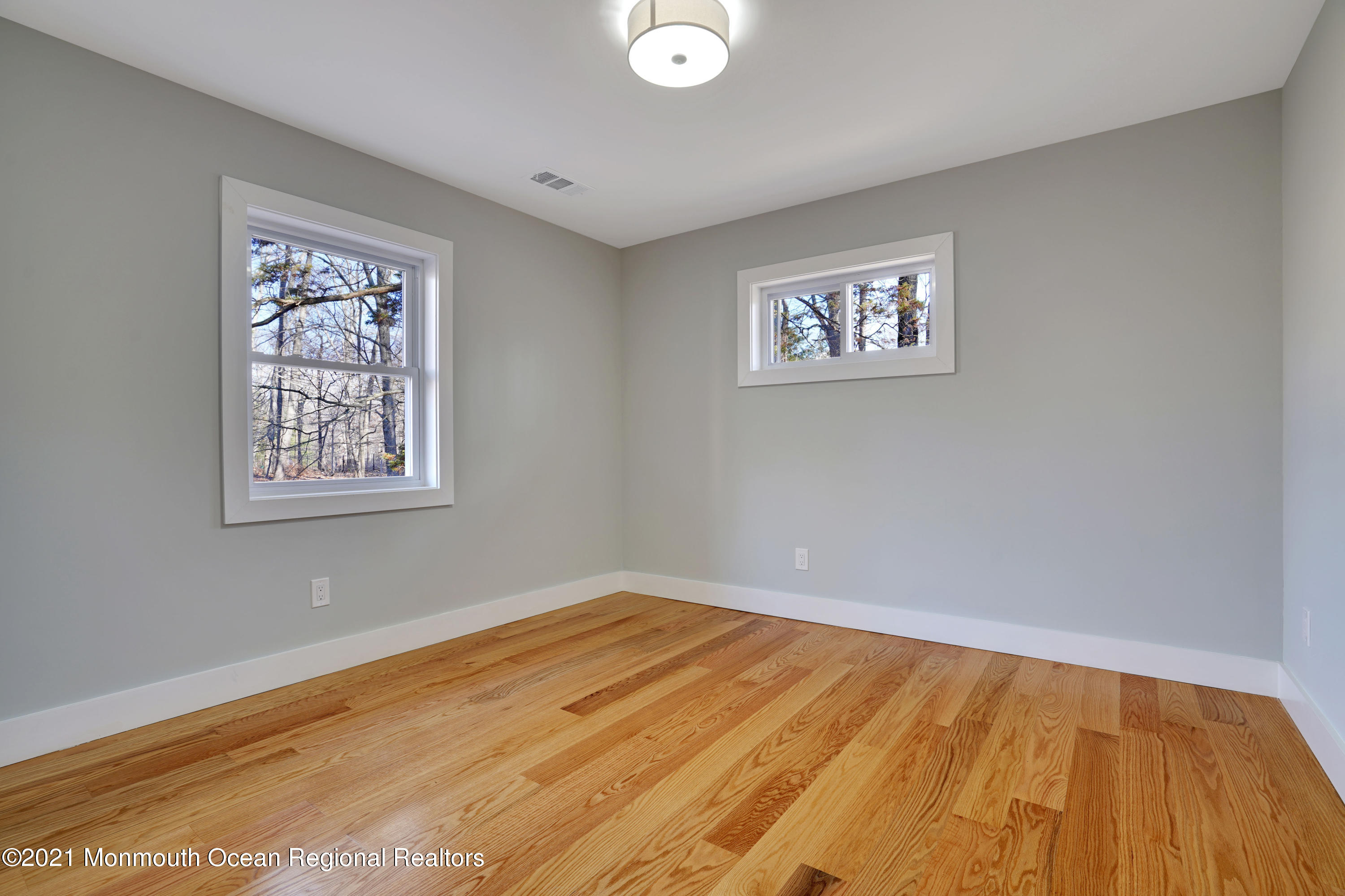 1155 Crim Road Bridgewater, NJ 08807 - Photo 23 of 29 a view of a big room with wooden floor and windows