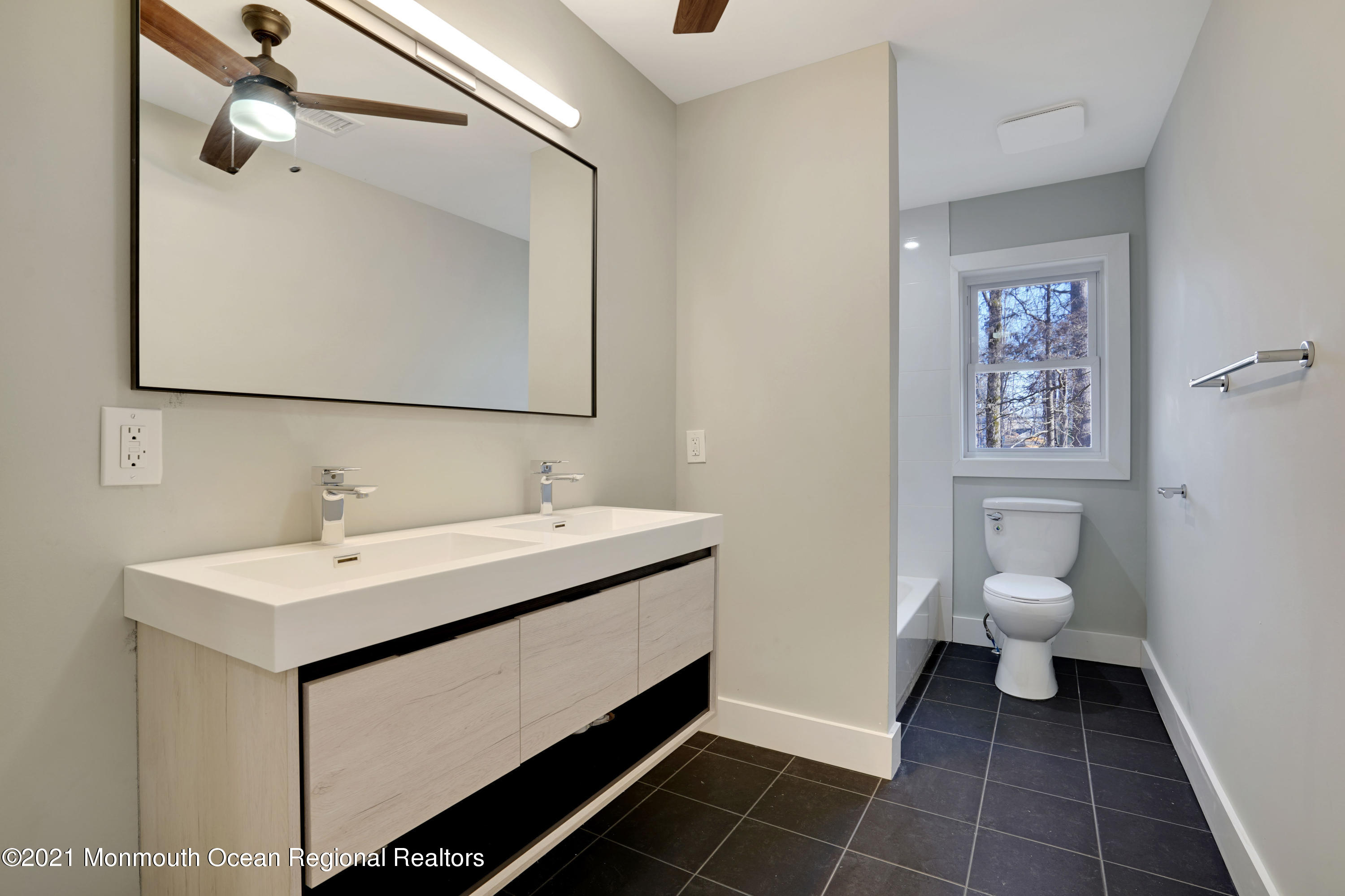 1155 Crim Road Bridgewater, NJ 08807 - Photo 24 of 29 a bathroom with a toilet sink and mirror