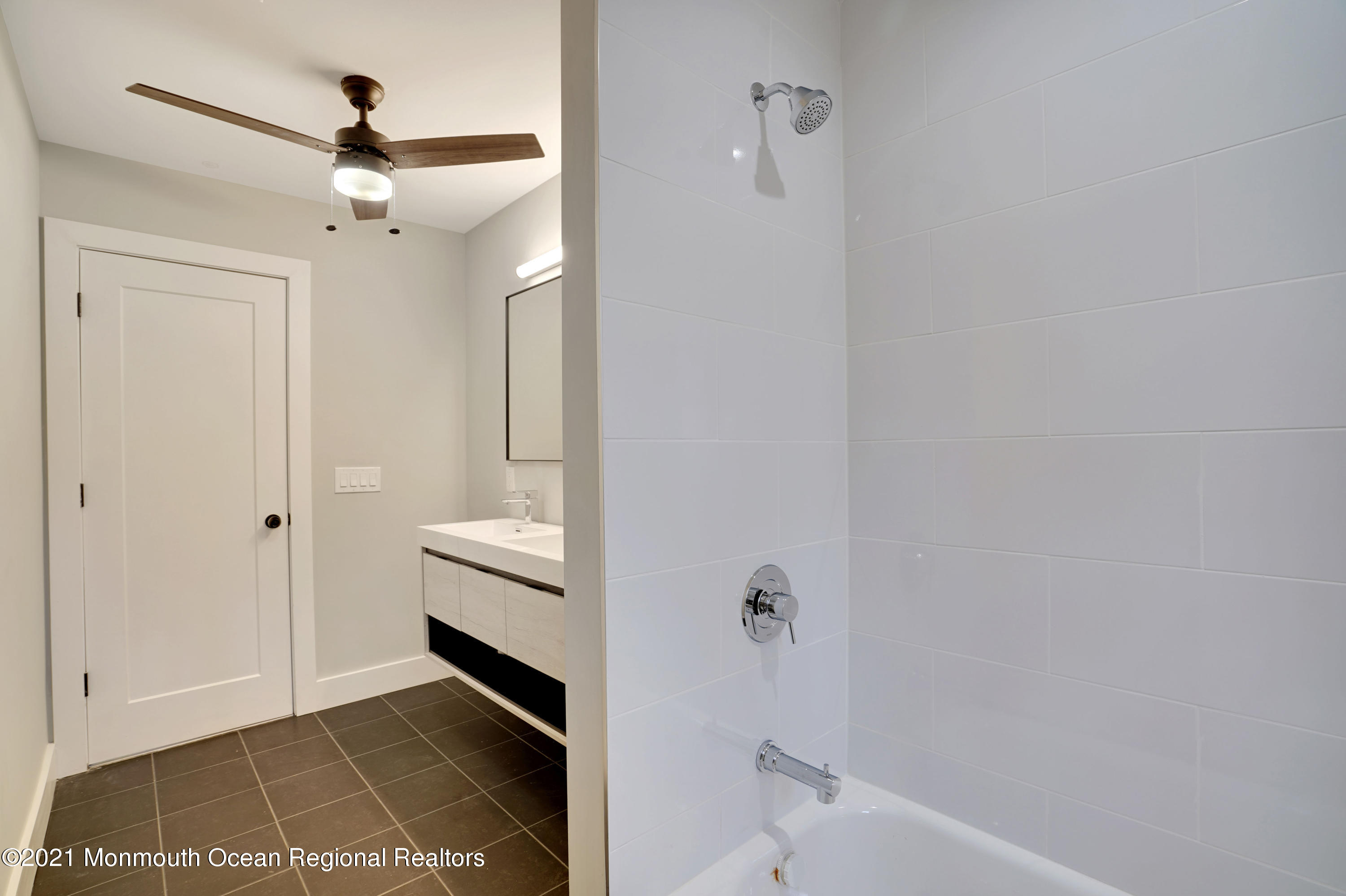 1155 Crim Road Bridgewater, NJ 08807 - Photo 25 of 29 a bathroom with a bathtub and a shower
