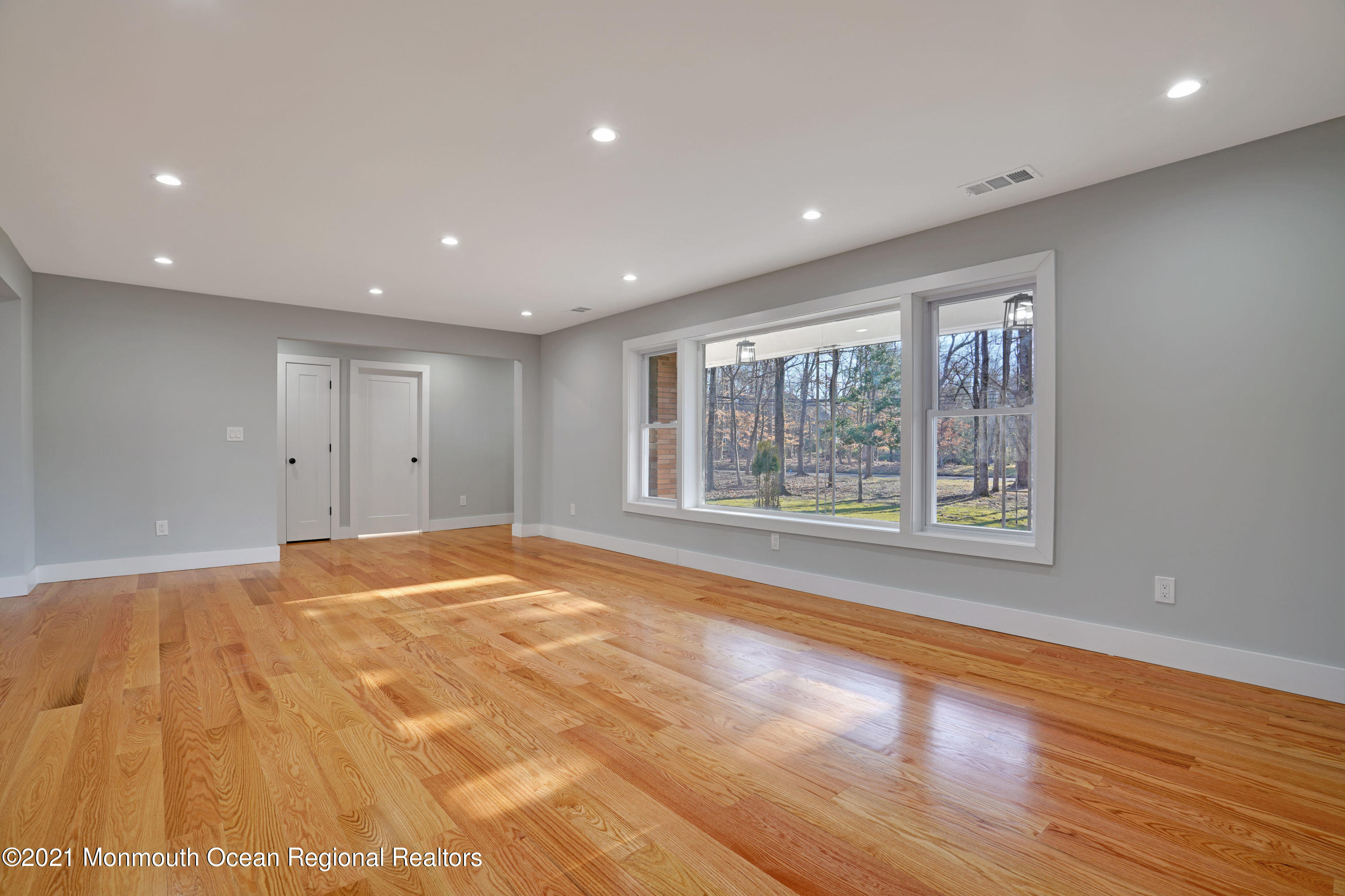 1155 Crim Road Bridgewater, NJ 08807 - Photo 7 of 29 a view of an empty room with wooden floor and a window
