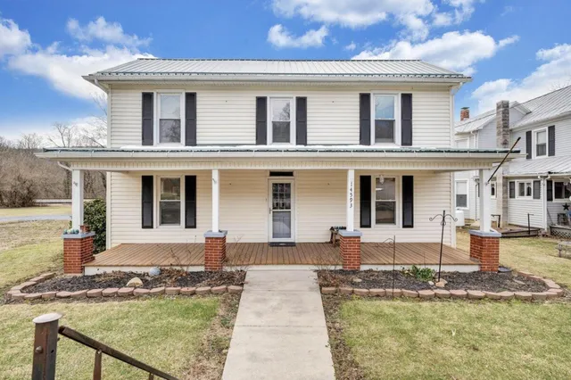 a front view of a house with swimming pool