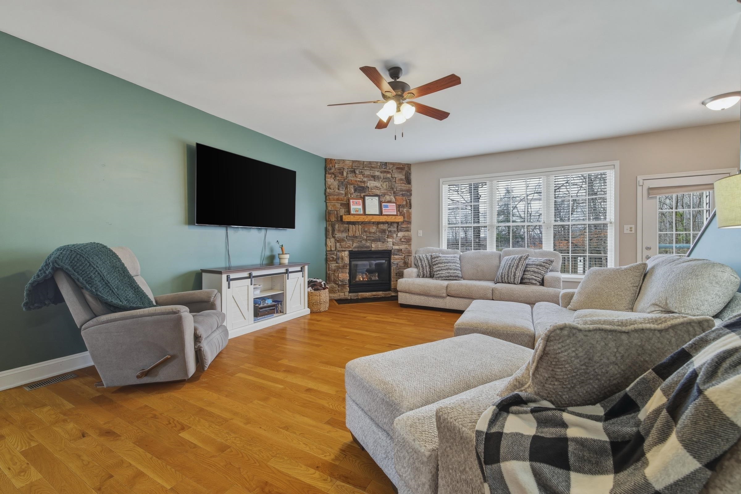 257 Hunter Road Maurertown, VA 22644 - Photo 5 of 61 a living room with fireplace furniture and a flat screen tv