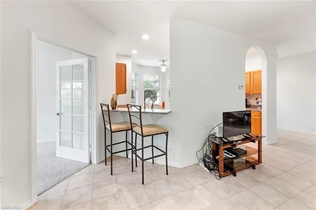 a view of a livingroom with furniture and a window