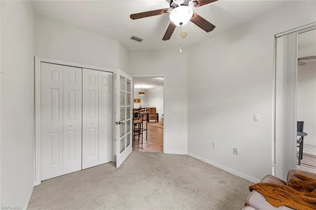 an empty room with closet area