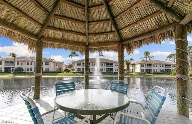 a view of a swimming pool with a table and chairs