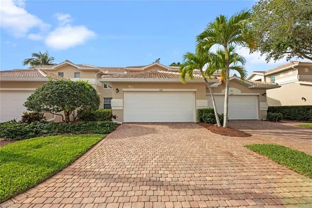 a front view of a house with a garden and entryway