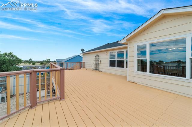 12576 Snaffle Bit Road Peyton, CO 80831 - Photo 4 of 37 Walk out from the breakfast nook to the big back deck.