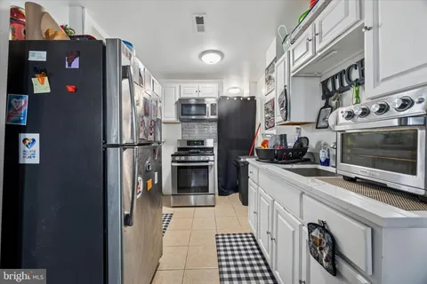 a bedroom with a bed and dresser