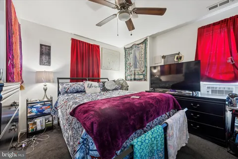 a bedroom with a bed and a closet