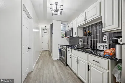 a bedroom with a bed and a mirror