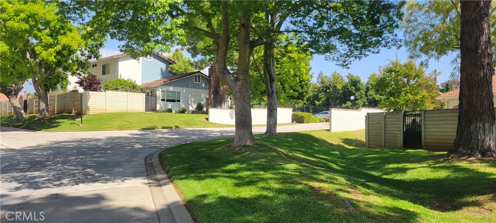 4 Dearborn Circle Redlands, CA 92374 - Photo 16 of 17 a front view of a house with yard and green space