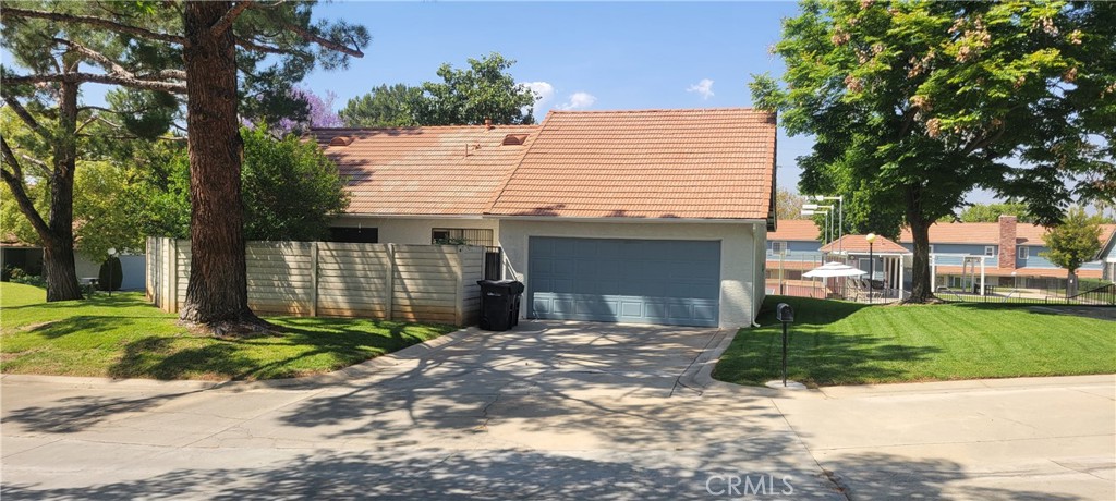 4 Dearborn Circle Redlands, CA 92374 - Photo 17 of 17 a front view of a house with a yard and garage
