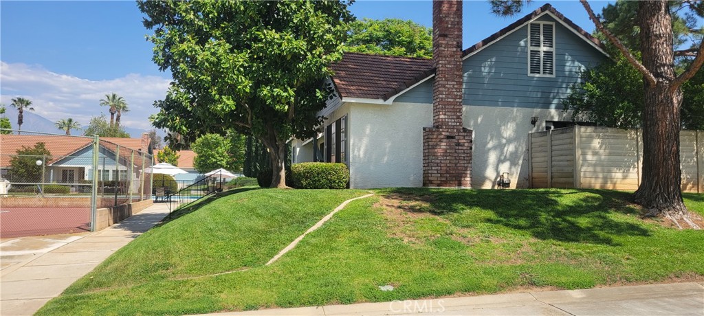 4 Dearborn Circle Redlands, CA 92374 - Photo 2 of 17 a front view of a house with a yard
