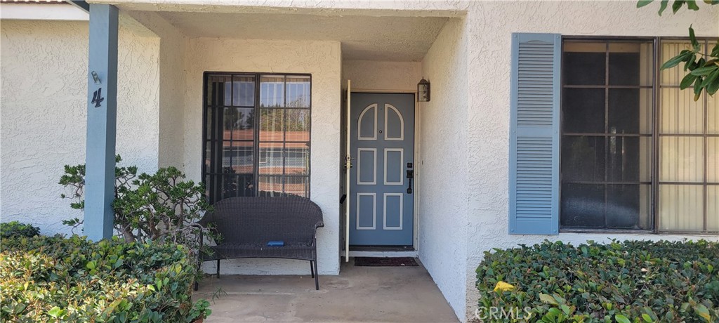 4 Dearborn Circle Redlands, CA 92374 - Photo 3 of 17 a couple of potted plants in front of door